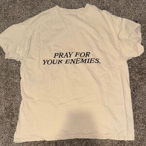 Cream Tee: pray for your enemies. No size; fits like oversized medium or large
